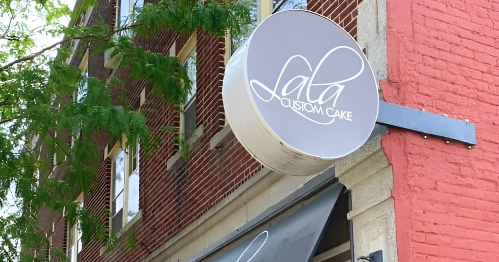 The LaLa Custom Cake sign over the sidewalk outside its Madison Avenue storefront